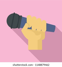 Microphone in hand icon. Flat illustration of microphone in hand vector icon for web design