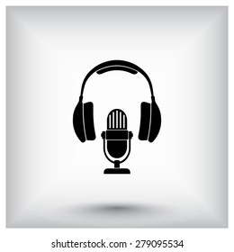 Microphone with headphones sign icon, vector illustration. Flat design style
