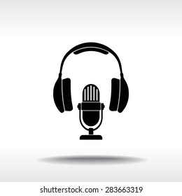 Microphone with headphones sign icon, vector illustration. Flat design style