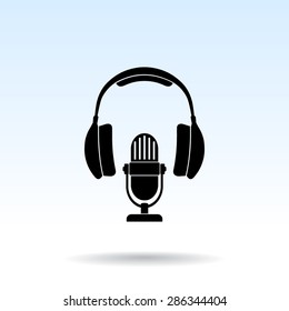 Microphone with headphones sign icon, vector illustration. Flat design style