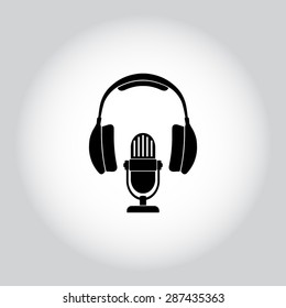 Microphone with headphones sign icon, vector illustration. Flat design style