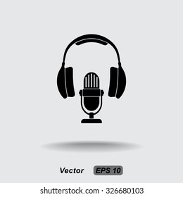 Microphone with headphones sign icon, vector illustration. Flat design style