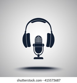 Microphone with headphones sign icon, vector illustration. Flat design style