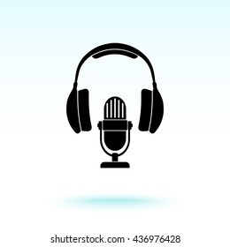 Microphone with headphones sign icon, vector illustration. Flat design style