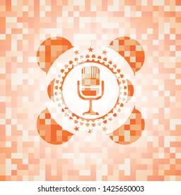 microphone icon inside abstract emblem, orange mosaic background