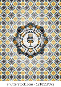 microphone icon inside arabesque badge. arabic decoration.