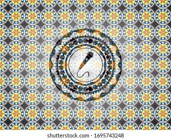 microphone icon inside arabic badge. Arabesque decoration.