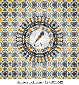 microphone icon inside arabic style badge. Arabesque decoration.
