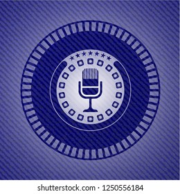 microphone icon inside badge with denim texture