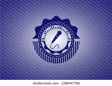 microphone icon inside badge with denim background