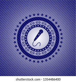 microphone icon inside badge with denim texture