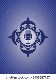 microphone icon inside badge with denim texture