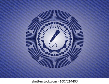 microphone icon inside badge with denim background
