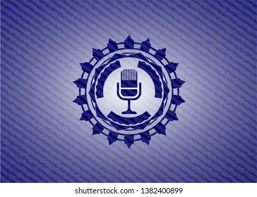 microphone icon inside badge with jean texture