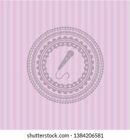 microphone icon inside badge with pink background