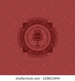 microphone icon inside badge with red background