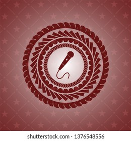 microphone icon inside badge with red background