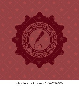 microphone icon inside badge with red background