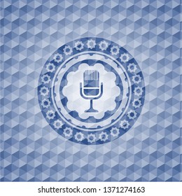 microphone icon inside blue badge with geometric pattern.