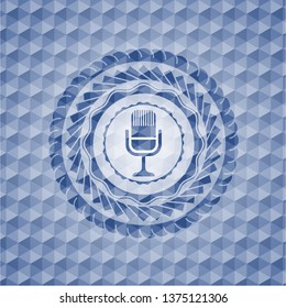 microphone icon inside blue badge with geometric pattern.