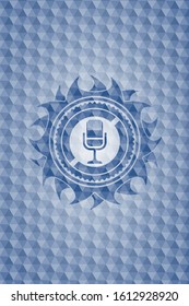 microphone icon inside blue badge with geometric pattern.