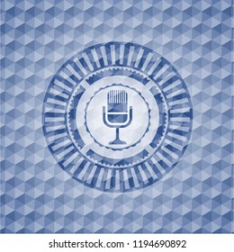 microphone icon inside blue emblem or badge with abstract geometric pattern background.