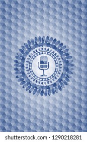 microphone icon inside blue emblem or badge with abstract geometric pattern background.