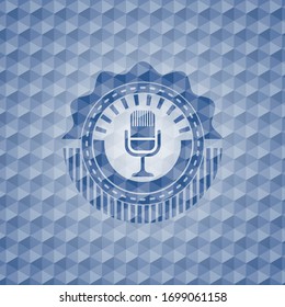 microphone icon inside blue emblem or badge with abstract geometric polygonal pattern background.