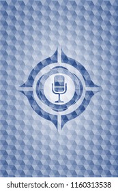 microphone icon inside blue polygonal emblem.