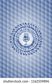 microphone icon inside blue polygonal emblem.