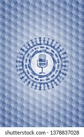 microphone icon inside blue polygonal emblem.