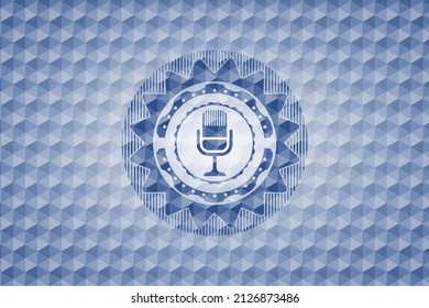 microphone icon inside blue polygonal badge. 