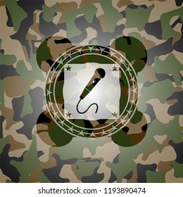 microphone icon inside camouflage emblem