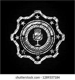 microphone icon inside chalk emblem