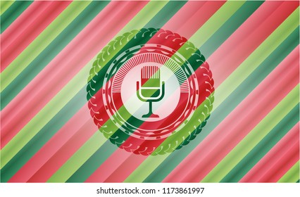 microphone icon inside christmas colors badge.