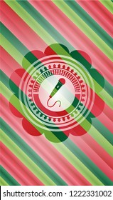 microphone icon inside christmas colors style emblem.