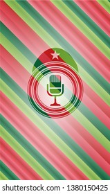 microphone icon inside christmas colors style emblem.