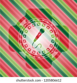 microphone icon inside christmas emblem.