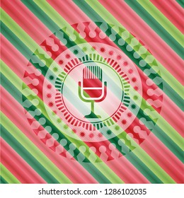 microphone icon inside christmas emblem background.