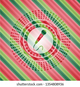 microphone icon inside christmas emblem.