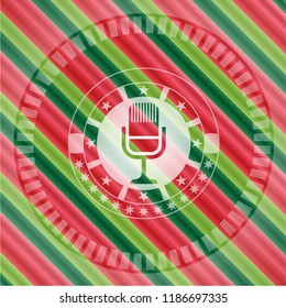 microphone icon inside christmas style badge..