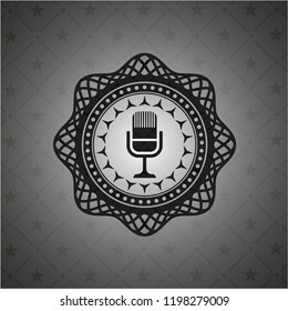 microphone icon inside dark badge or emblem