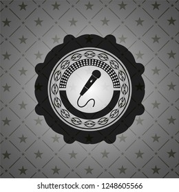 microphone icon inside dark badge