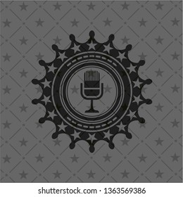 microphone icon inside dark badge