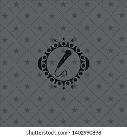 microphone icon inside dark badge or emblem