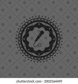 microphone icon inside dark badge or emblem. 