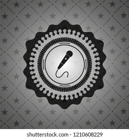 microphone icon inside dark emblem