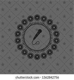 microphone icon inside dark emblem