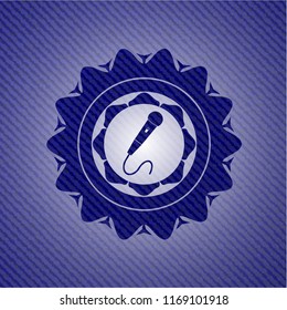 microphone icon inside denim background