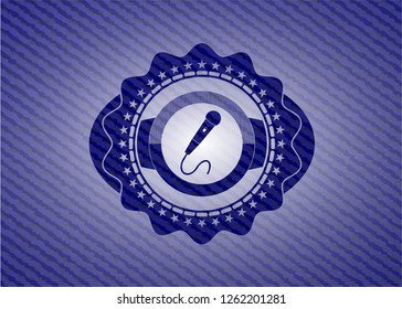 microphone icon inside denim background